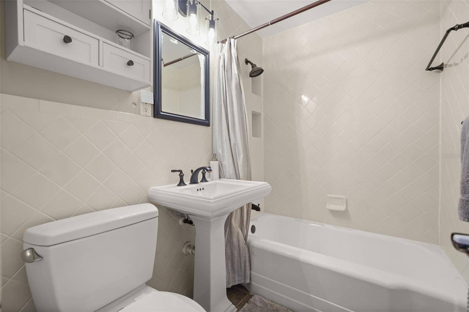 Bathroom with tub and shower combination