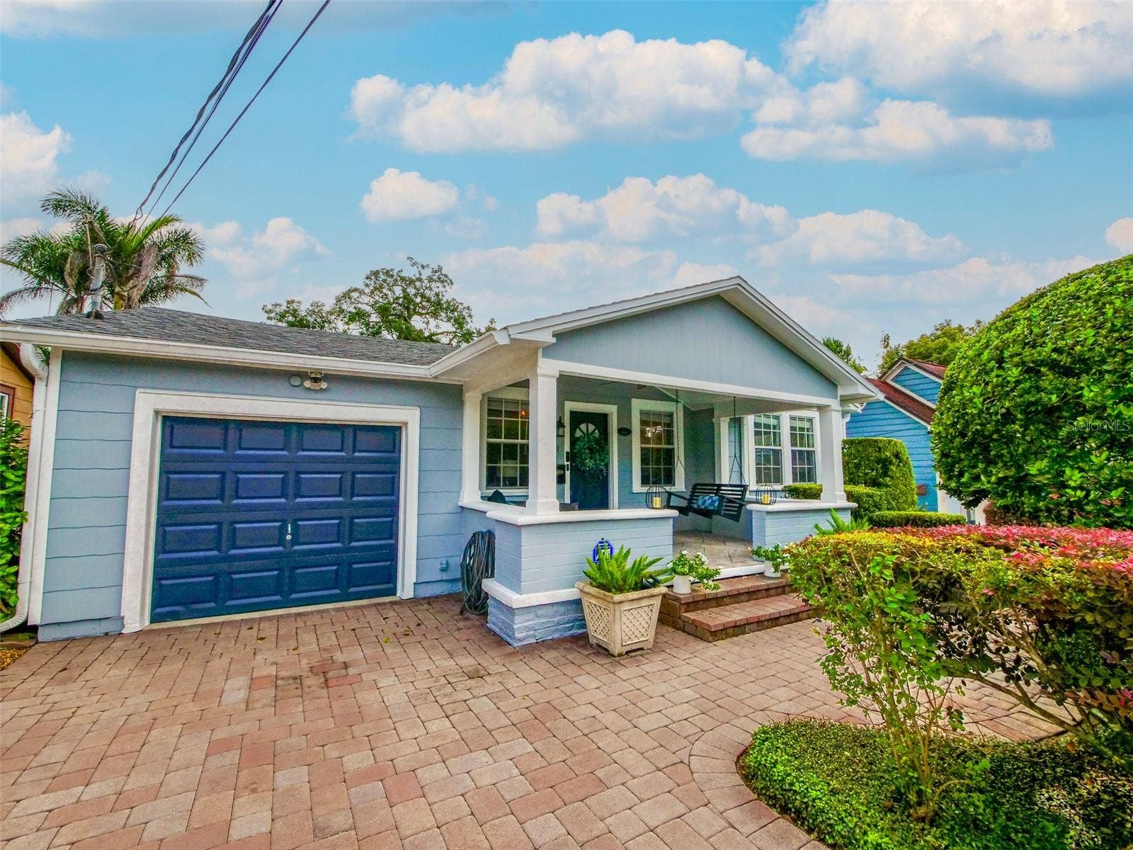Front exterior with garage and covered porch