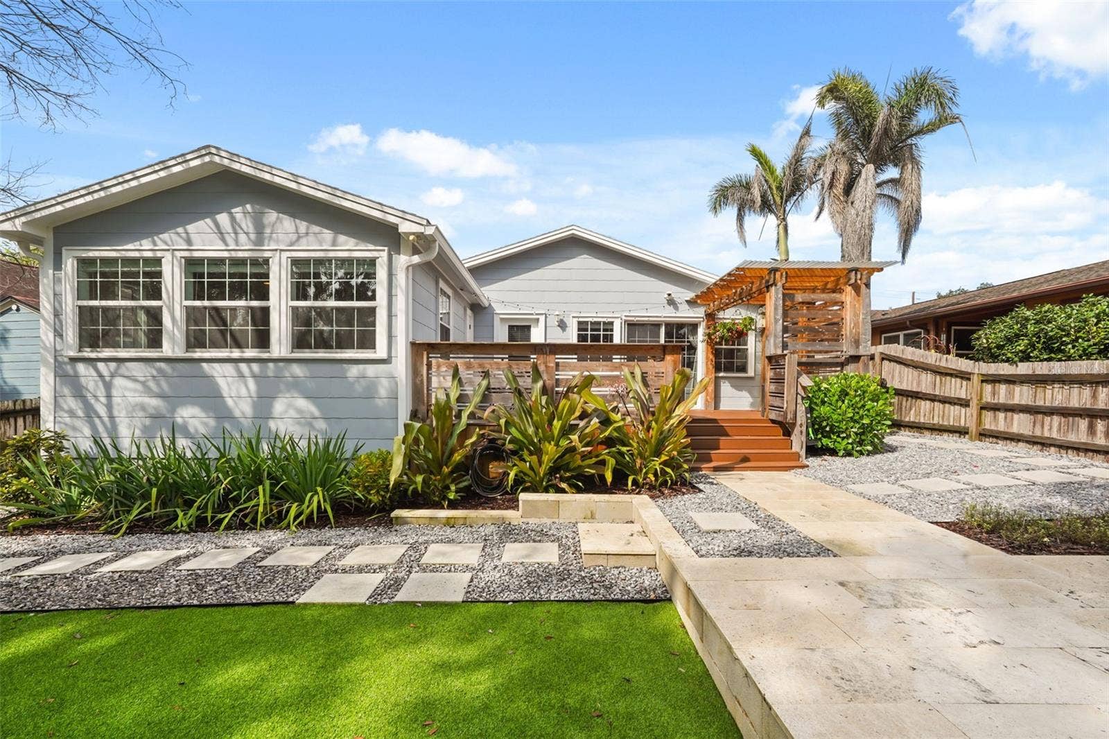 Rear exterior with landscaping and stepping stone path