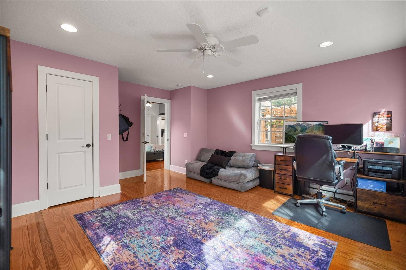Study with closet and wood floors