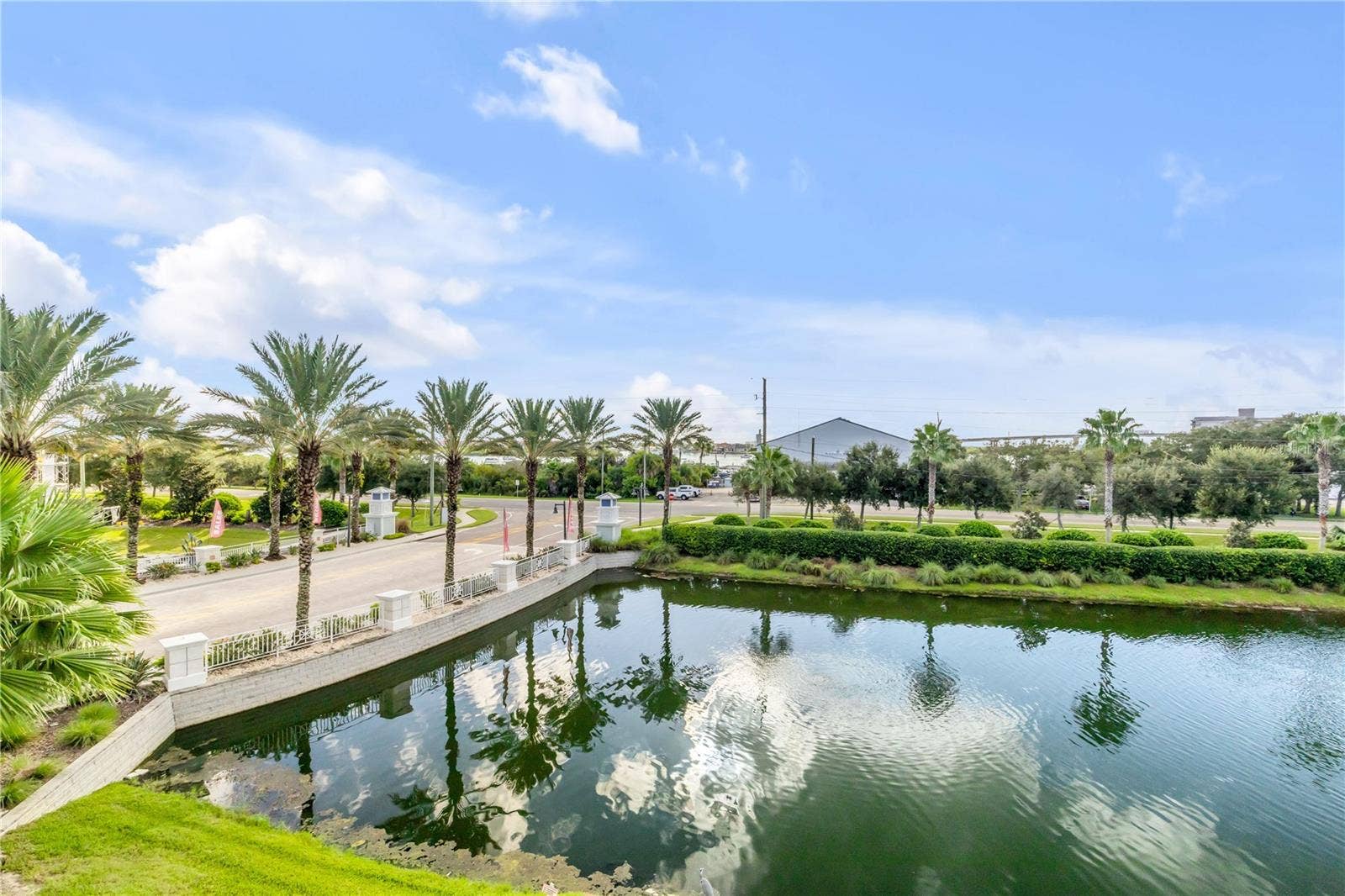 1 RIVERWALK DRIVE, #303, New Smyrna Beach, FL 32169 Back patio pond and Marina view