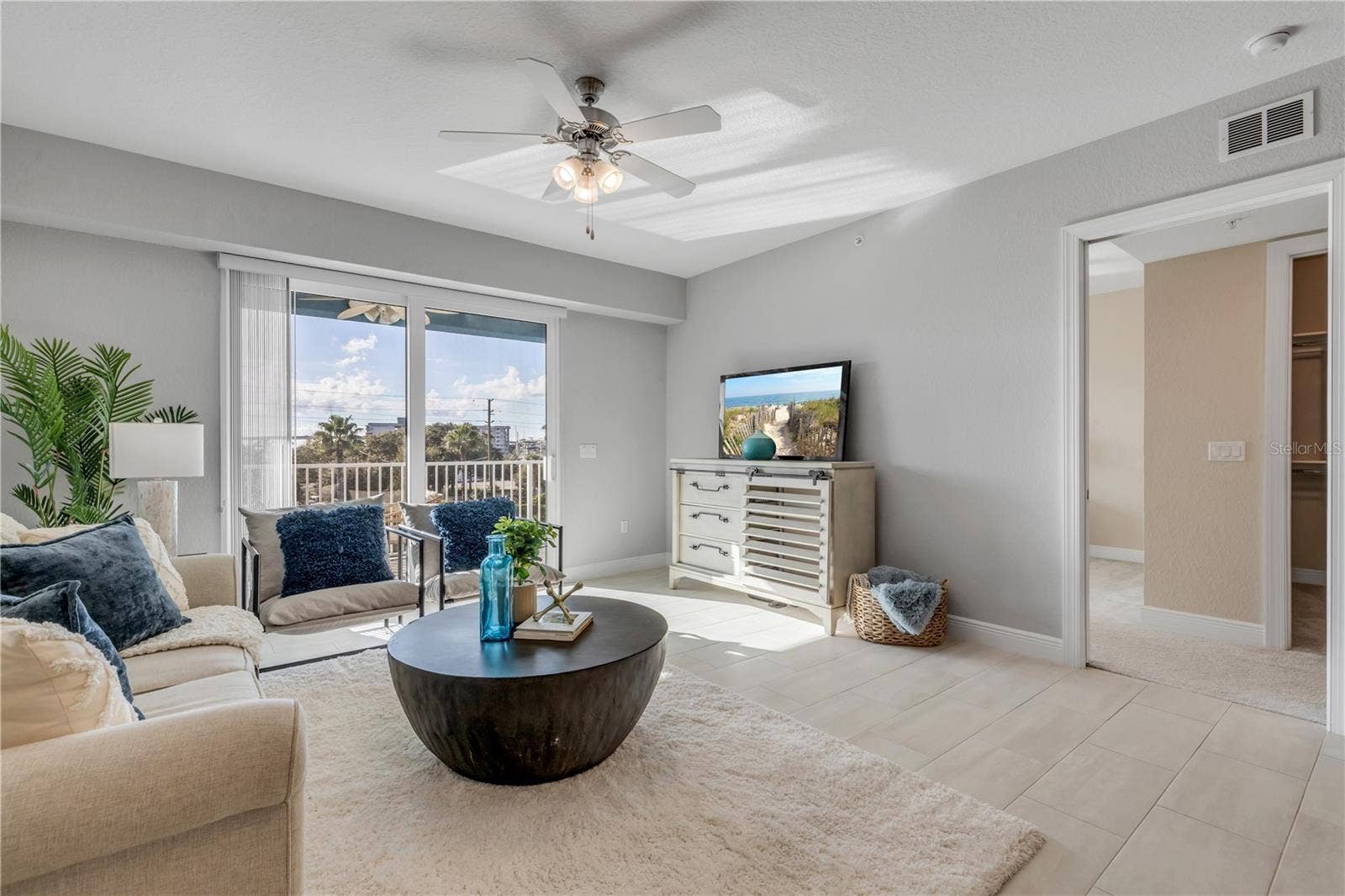 1 RIVERWALK DRIVE, #303, New Smyrna Beach, FL 32169 Living Room with large slider to the back patio