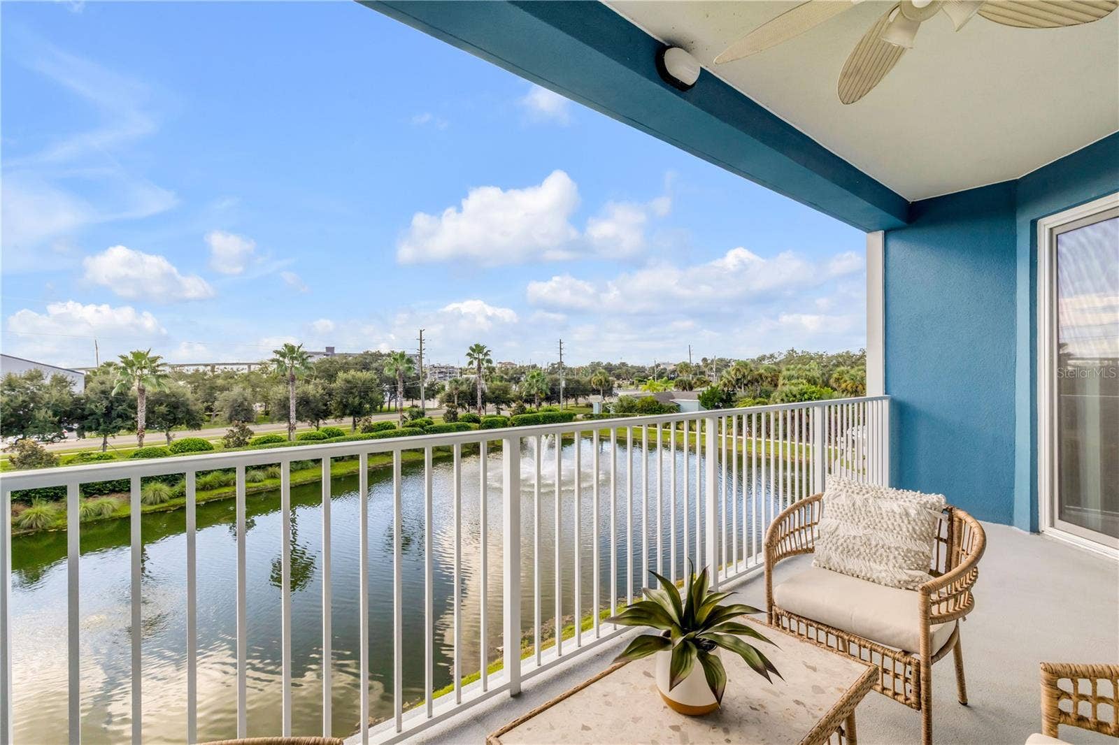 1 RIVERWALK DRIVE, #303, New Smyrna Beach, FL 32169 Back patio with pond and Marina view