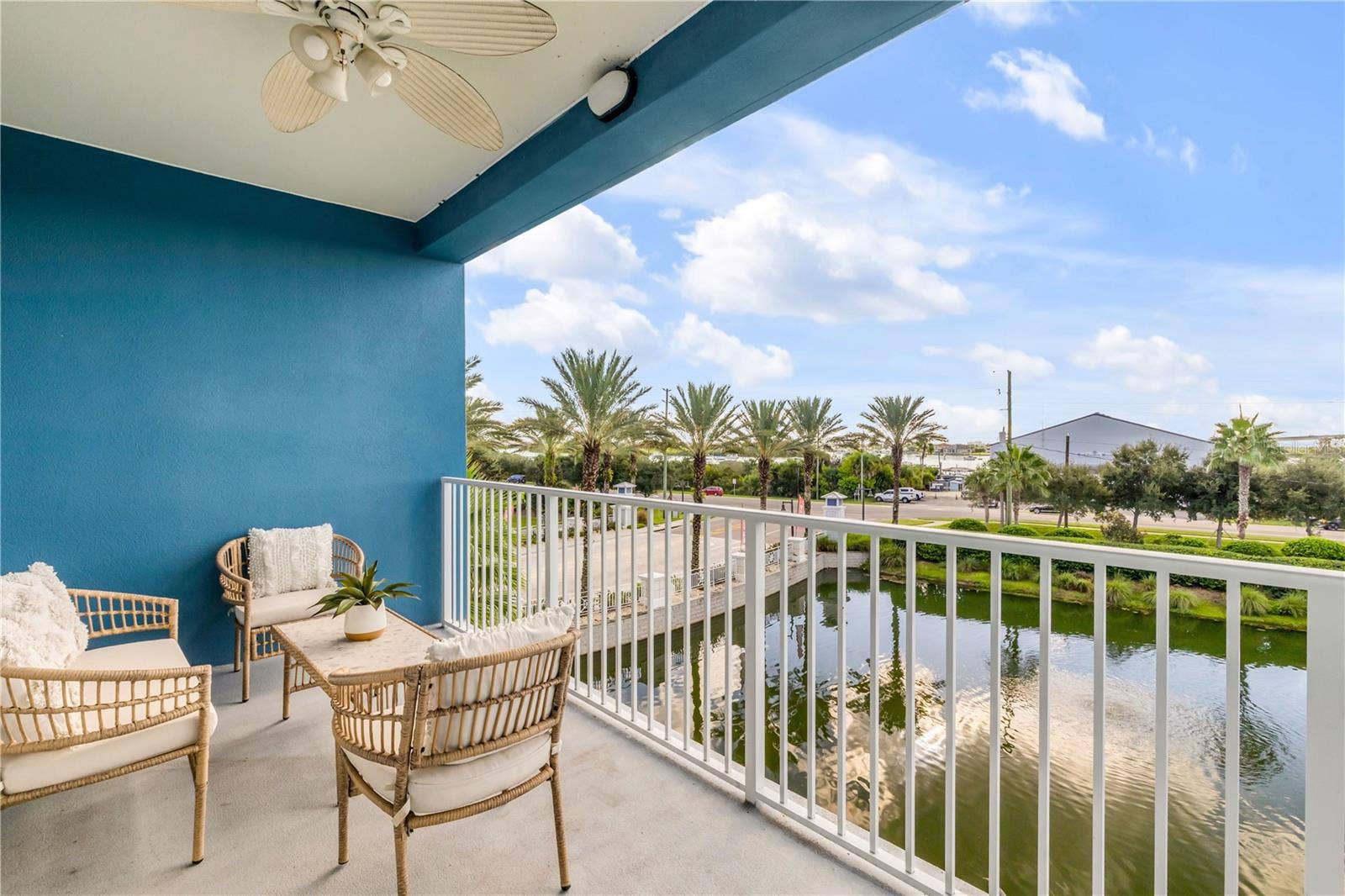 1 RIVERWALK DRIVE, #303, New Smyrna Beach, FL 32169 Back Patio with pond and Marina view