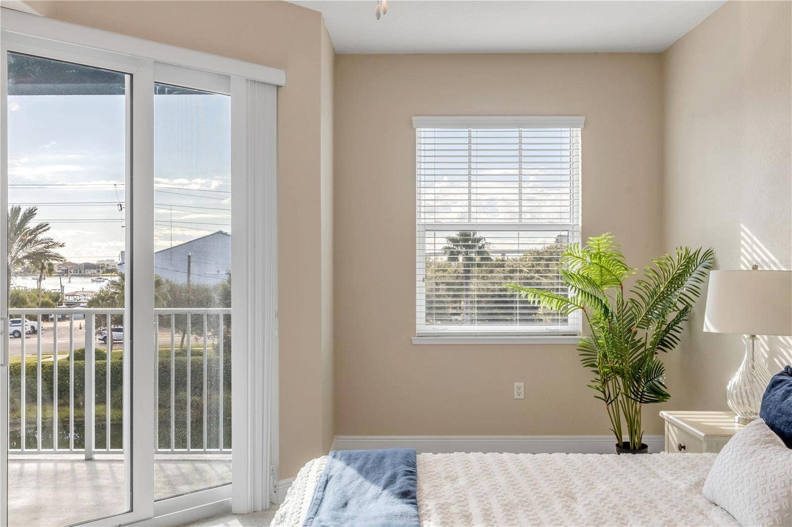 1 RIVERWALK DRIVE, #303, New Smyrna Beach, FL 32169 Primary Bedroom with slider to the back patio