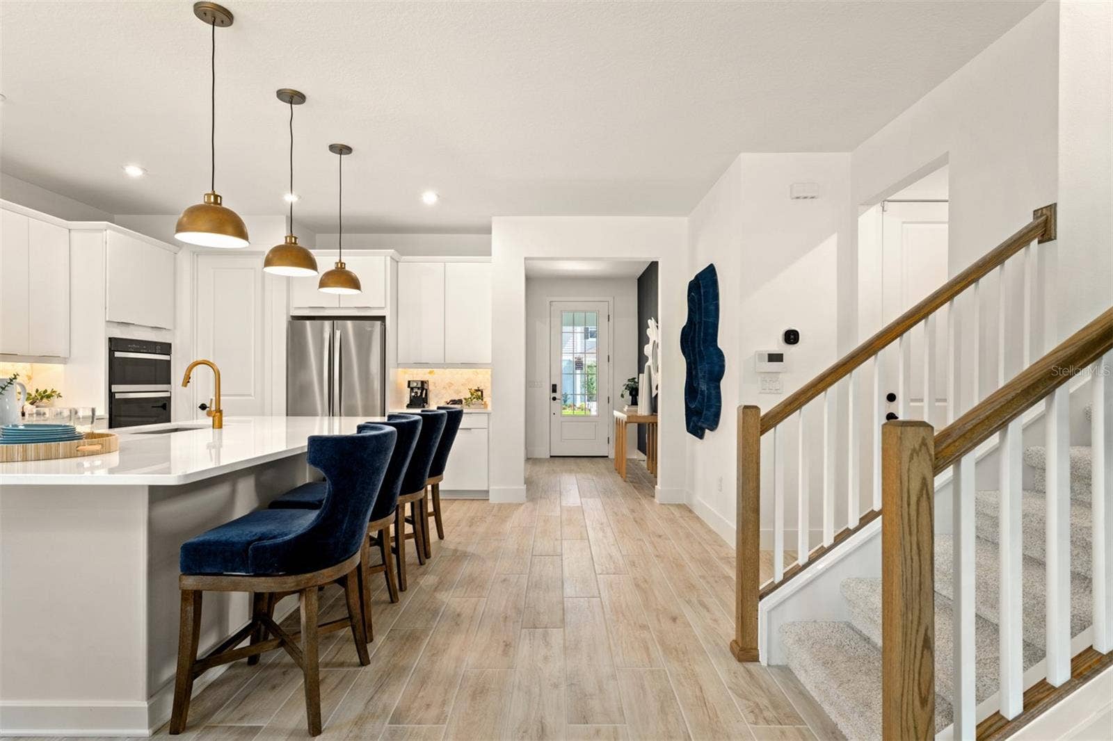 Meridian Parks Olympic Model Foyer, Kitchen and Stairs