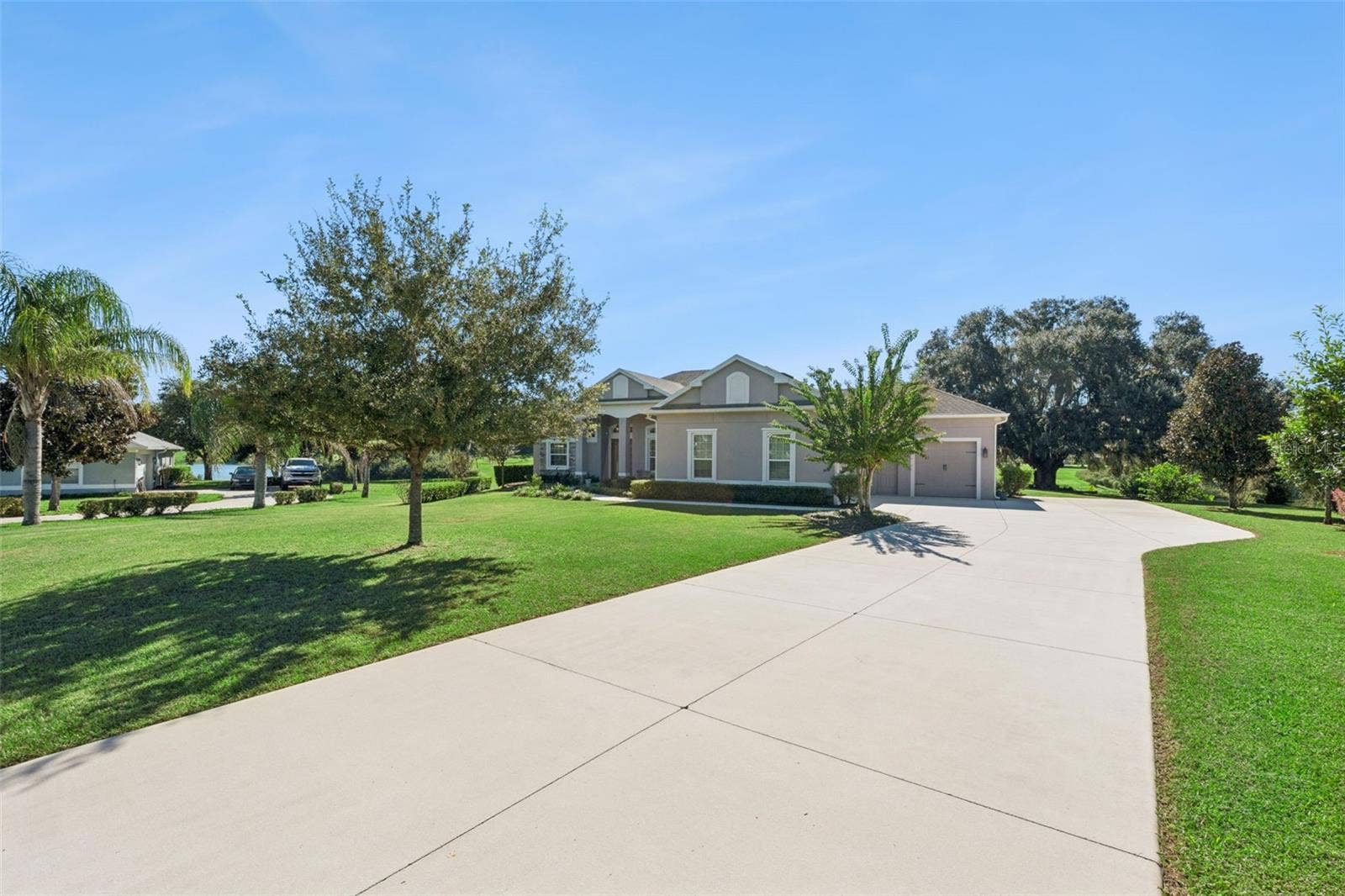 36819 WOLF COURT, Eustis, FL 32736 Located on over 1.6 acres with a long private driveway, this property offers unparalleled privacy and a serene atmosphere. The expansive grounds provide ample space for outdoor activities, gardening, or potential future enhancements, while the lengthy driveway creates an inviting sense of seclusion and grandeur as you approach the home.