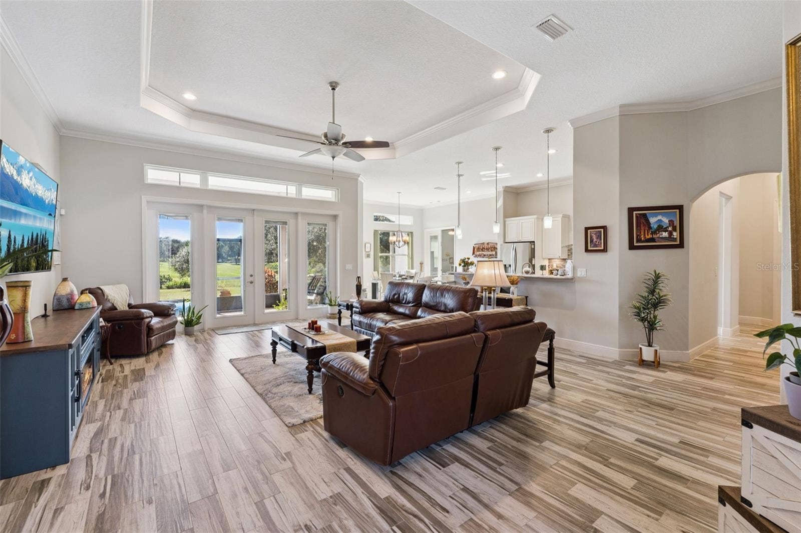 36819 WOLF COURT, Eustis, FL 32736 Welcome guests through the front double door into the open floor plan with family room with a beautiful water view
