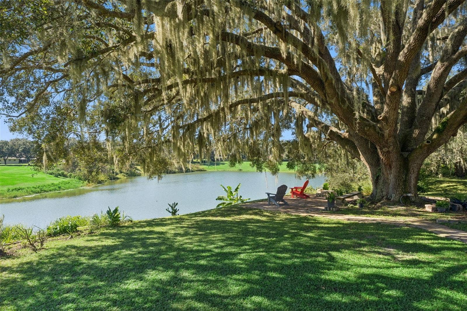 36819 WOLF COURT, Eustis, FL 32736 Enjoy serene mornings with coffee in hand under your oak tree