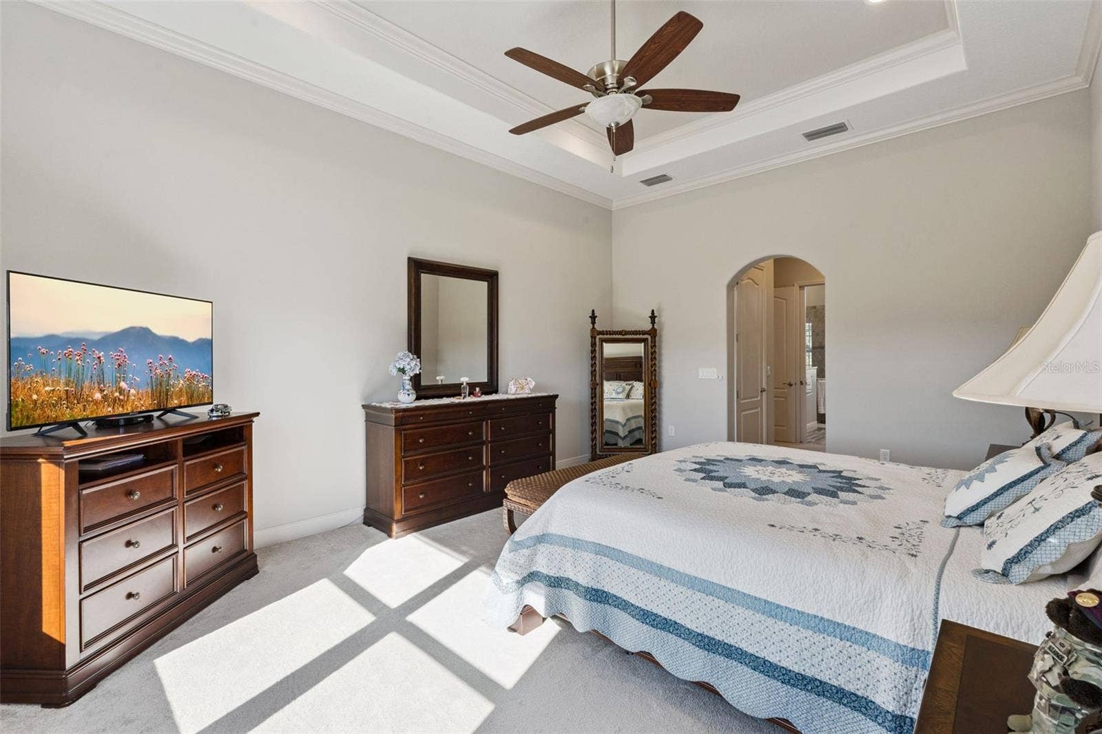 36819 WOLF COURT, Eustis, FL 32736 Primary suite featuring a spacious layout and a direct, open view into the private en suite bathroom.