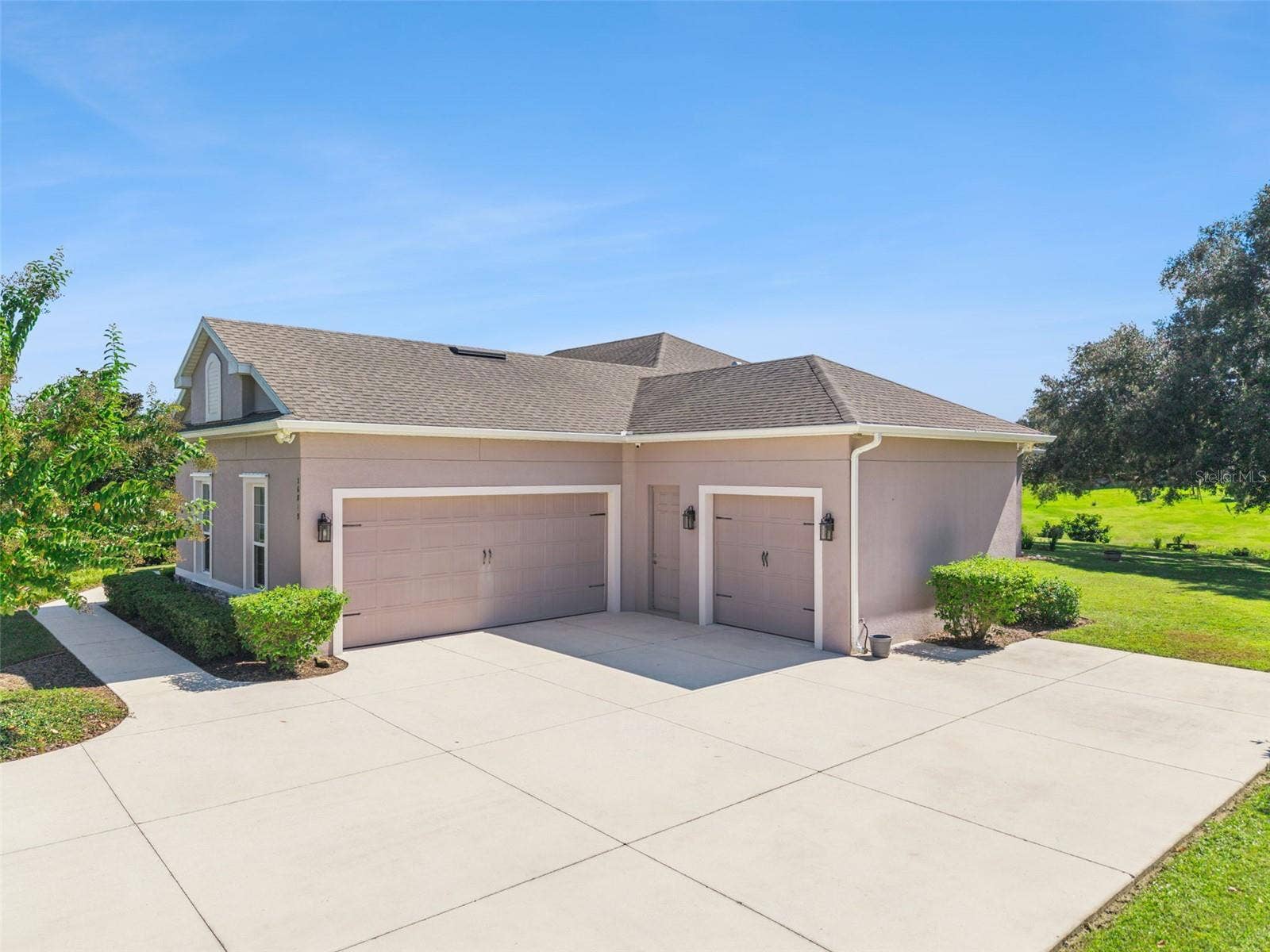 36819 WOLF COURT, Eustis, FL 32736 Spacious 3 car garage with storage racks and room for all your vehicles
