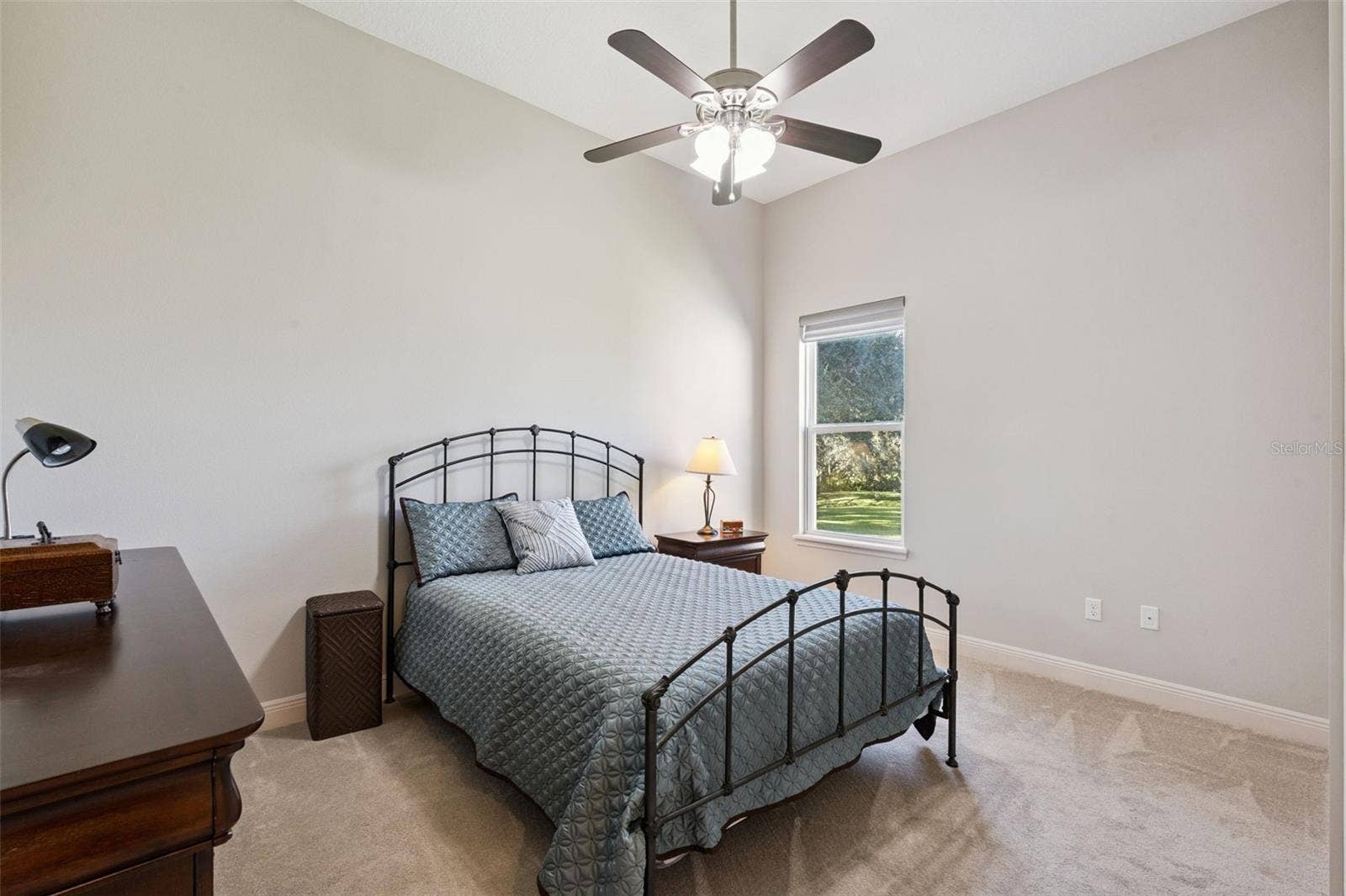 36819 WOLF COURT, Eustis, FL 32736 Bedroom 3 features a spacious walk-in closet, a ceiling fan for climate control, and a neutral paint palette that serves as a perfect blank canvas for any dcor style.