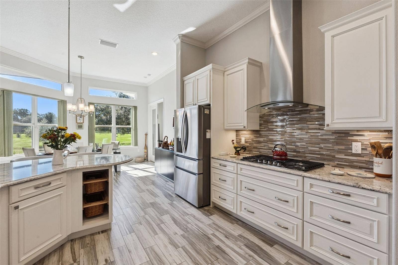 36819 WOLF COURT, Eustis, FL 32736 Stacked glass block backsplash, gas stove and stainless venthood