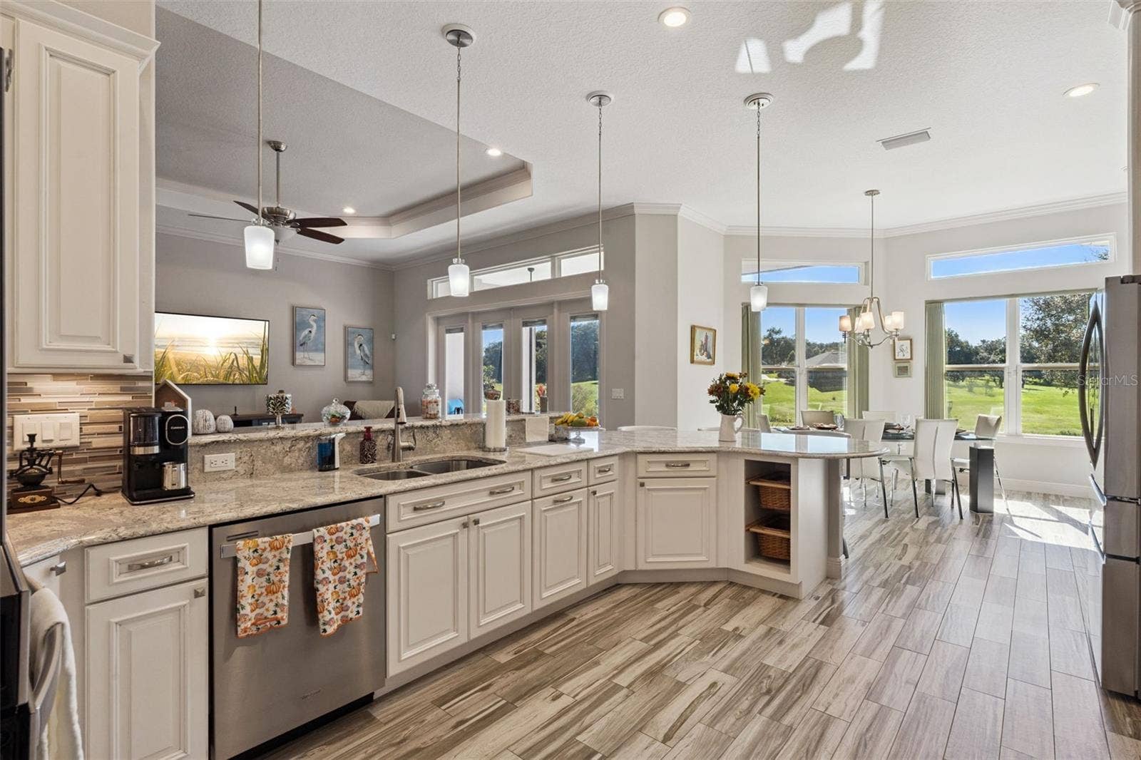 36819 WOLF COURT, Eustis, FL 32736 This kitchen is a chefs delight with quartz countertops, 42" cabinets and stainless appliances