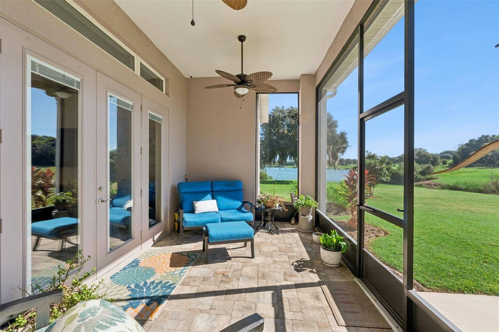 36819 WOLF COURT, Eustis, FL 32736 Covered lanai with pavers overlooking the water