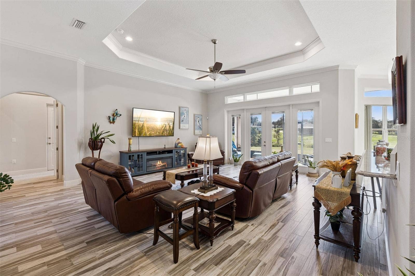 36819 WOLF COURT, Eustis, FL 32736 Family room with french doors to screened lanai