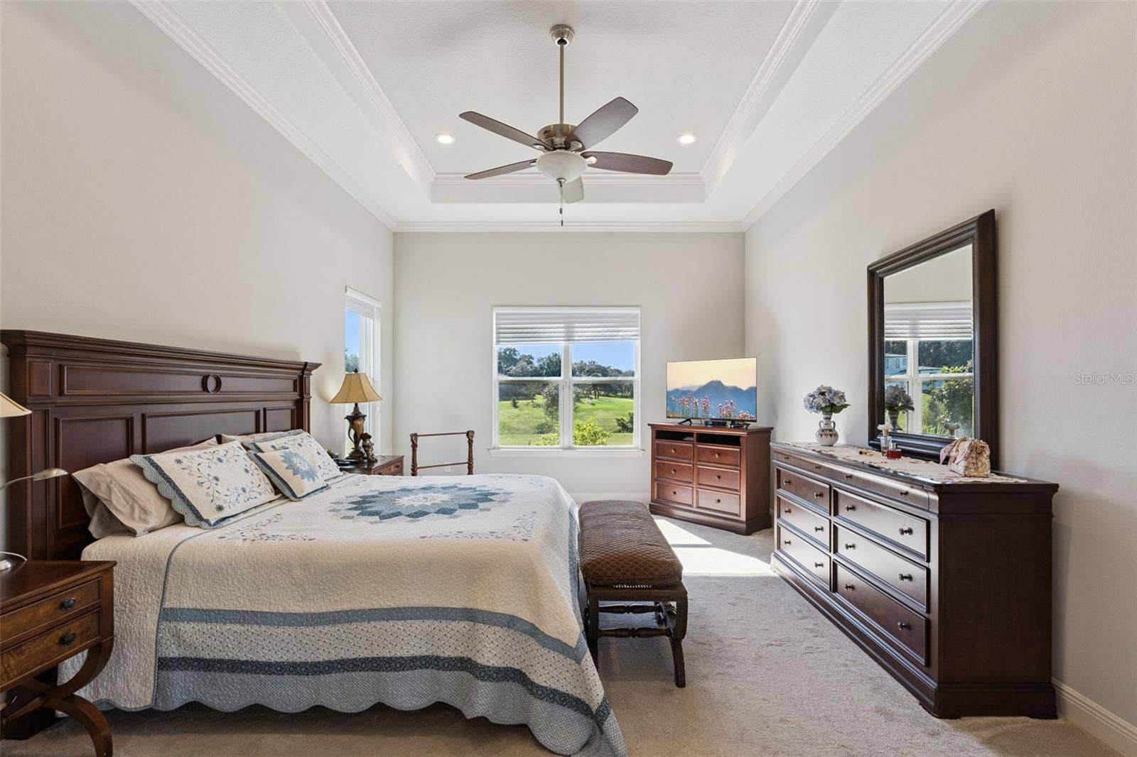 36819 WOLF COURT, Eustis, FL 32736 Private primary suite featuring a serene, expansive water view that brings tranquility into the living space.