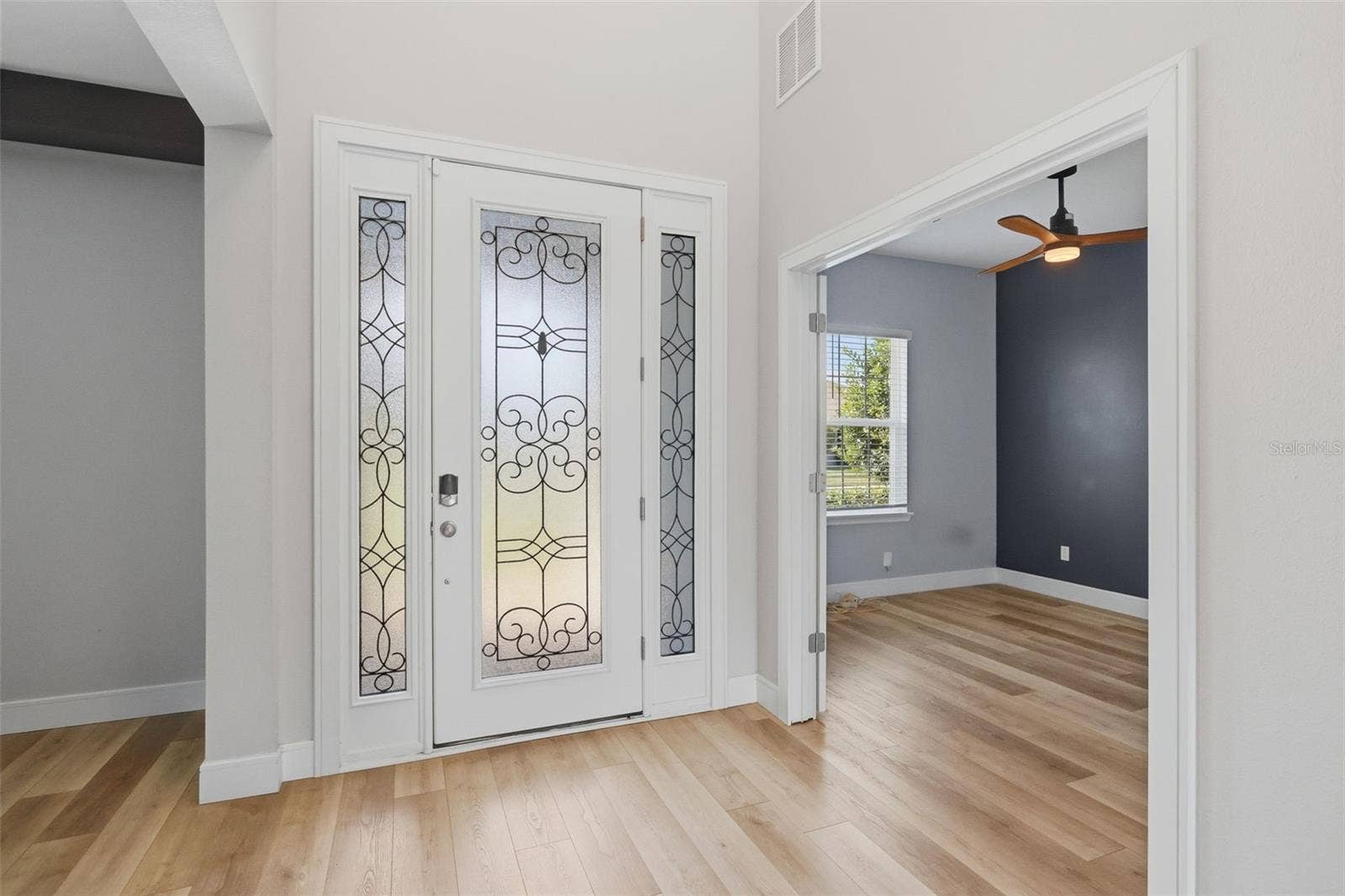 1552 MYRTLE OAKS TRAIL, Oviedo, FL 32765 Entrance with dining area on one side and office on the other