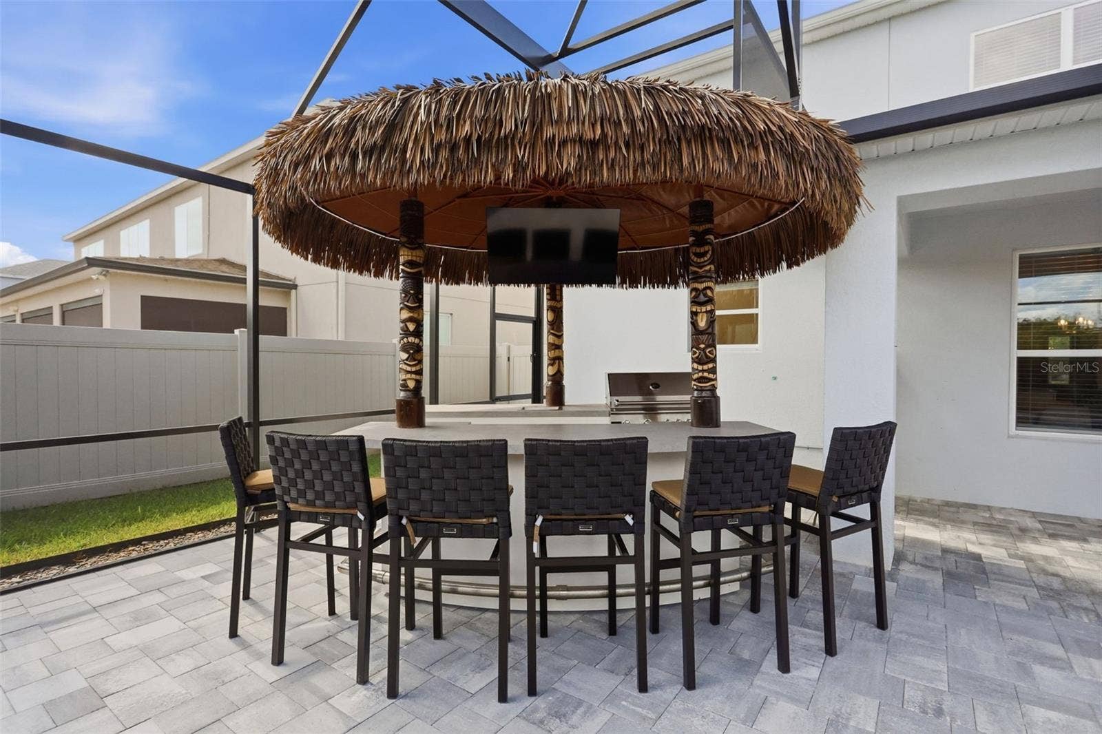 1552 MYRTLE OAKS TRAIL, Oviedo, FL 32765 Tiki bar and outdoor kitchen with huge paved patio provides such an amazing entertaining area
