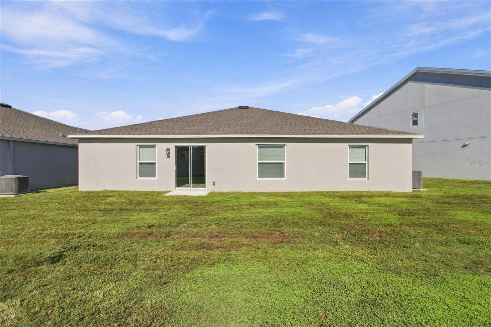 Enjoy the outdoor patio and spacious backyard, with plenty of room to add a fence.