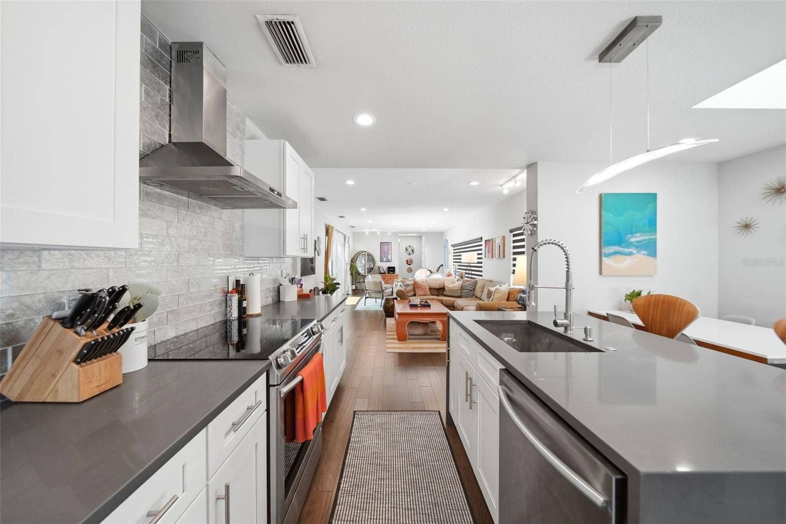 15 x 17 totally renovated kitchen with shaker cabinets, stainless appliances and vent hood. Counters and island are quartz.