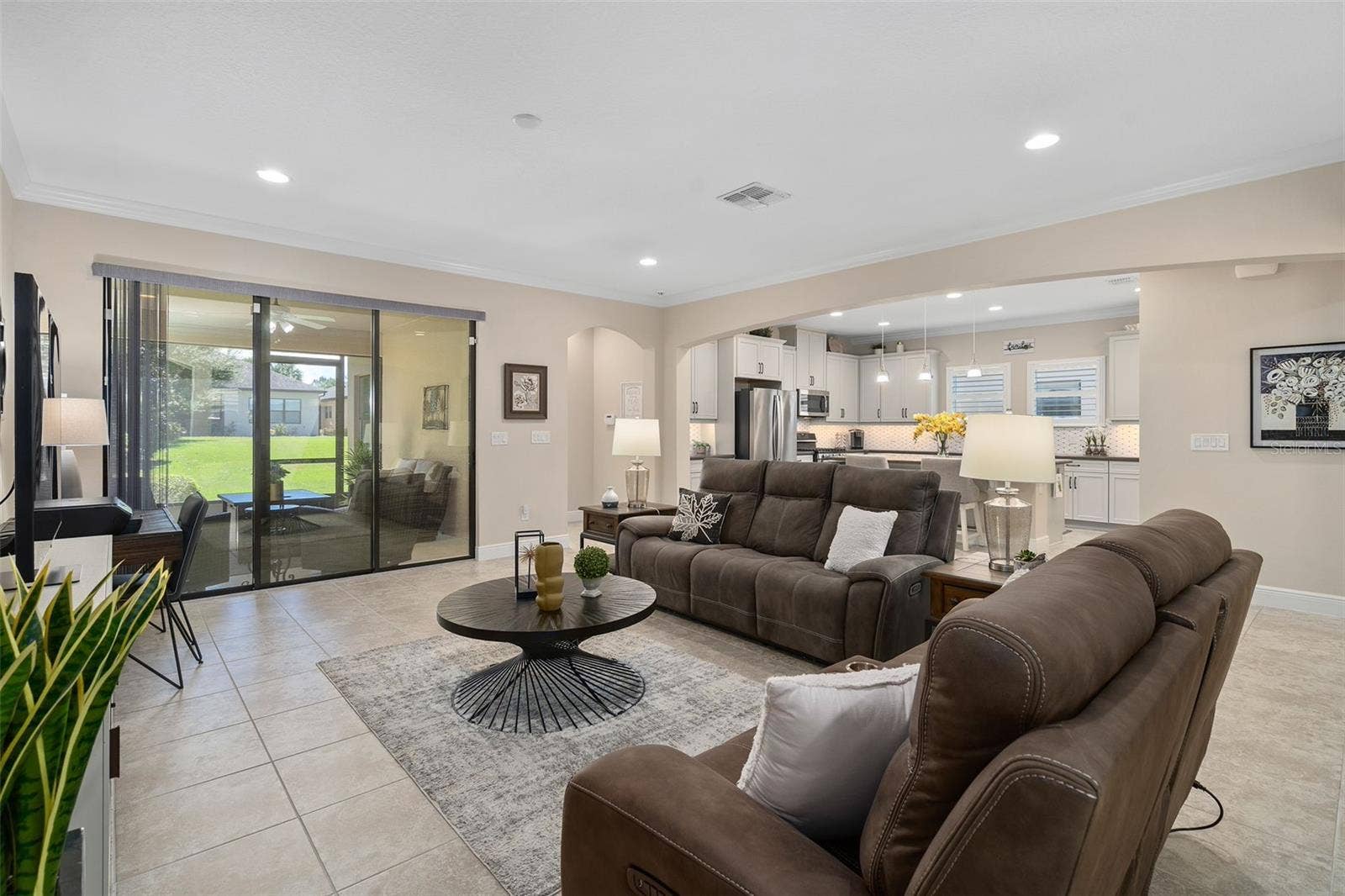2607 CLEMSON RIDGE COURT, Clermont, FL 34715 Family Room with the Kitchen in the background