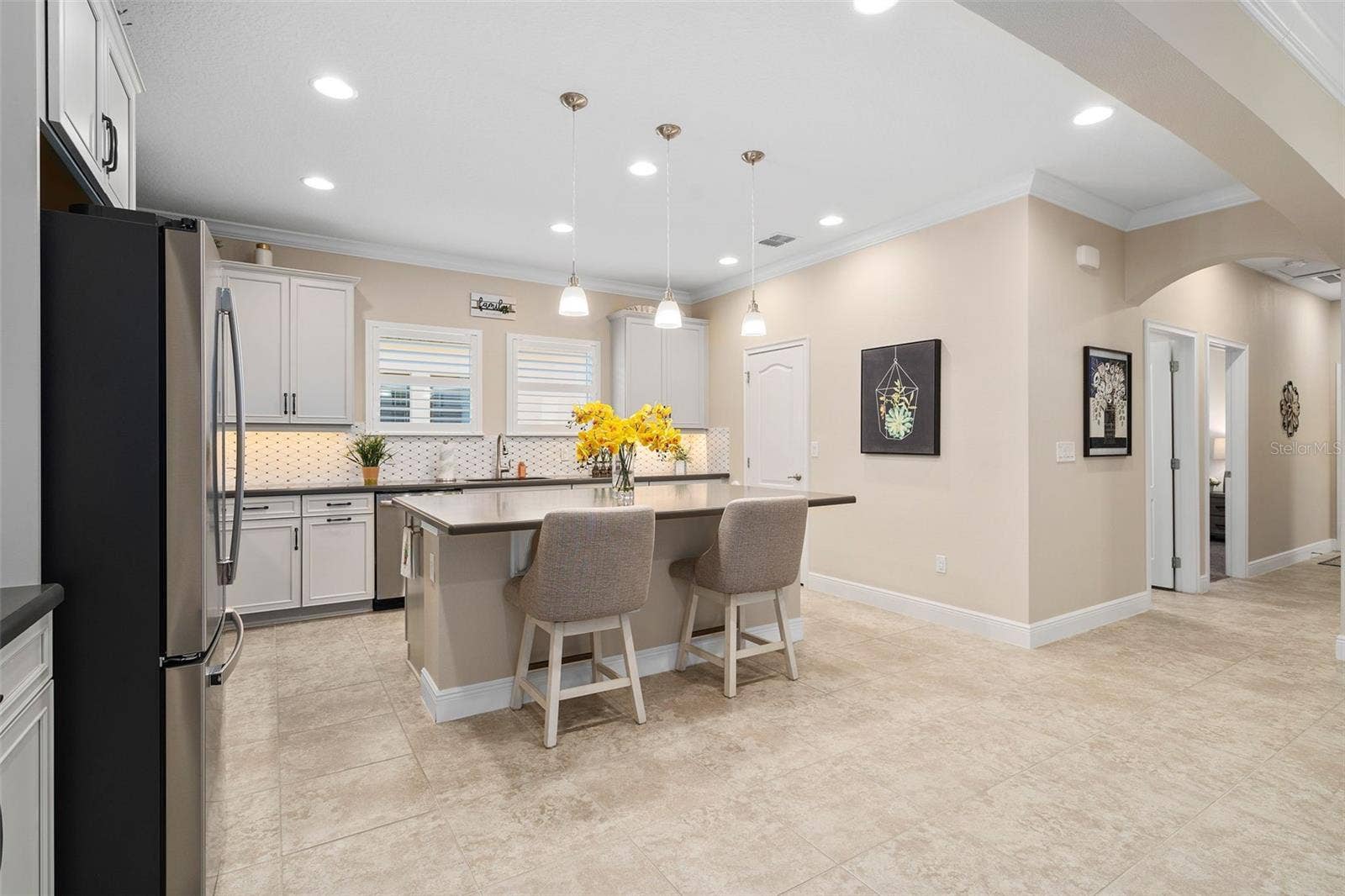 2607 CLEMSON RIDGE COURT, Clermont, FL 34715 Upgraded Solid Wood 42" Cabinetry with Under Cabinet Lighting and a Large Walk-in pantry grace the Kitchen