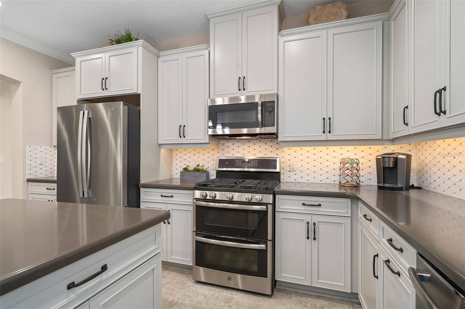 2607 CLEMSON RIDGE COURT, Clermont, FL 34715 The Kitchen offers great counter / prep space and the Microwave is vented to the outside.