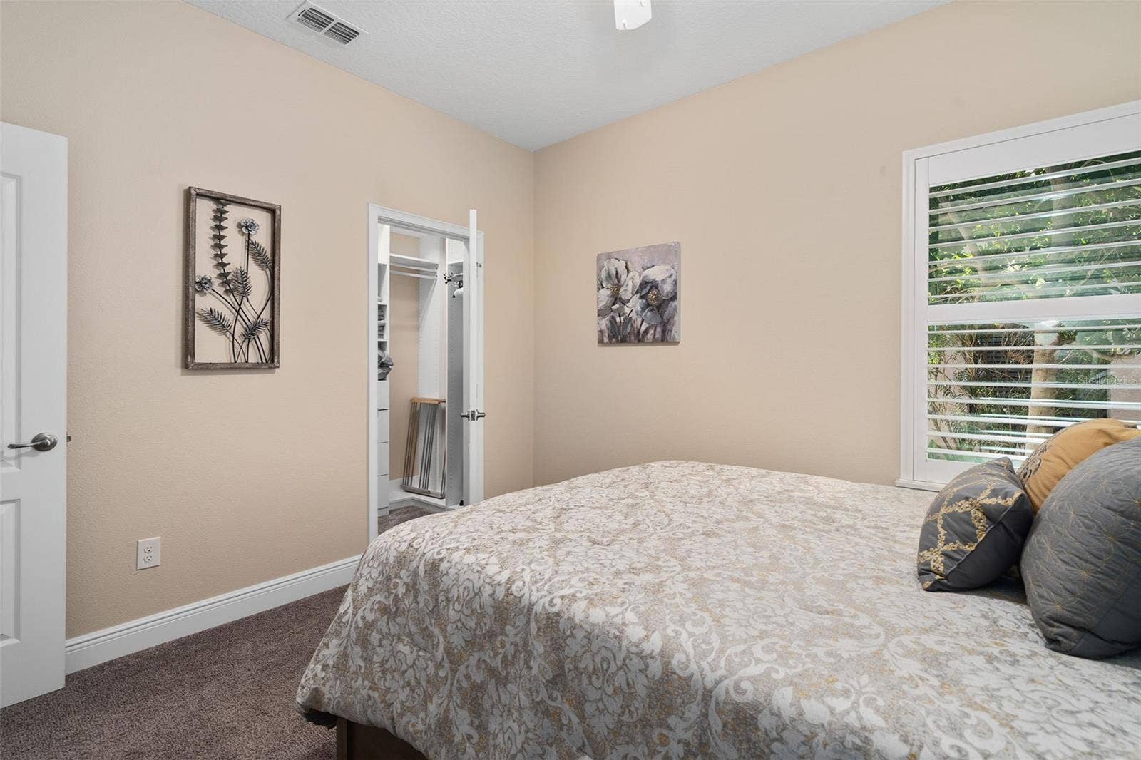 2607 CLEMSON RIDGE COURT, Clermont, FL 34715 Bedroom 2 offers a Walk-in Custom Organized closet