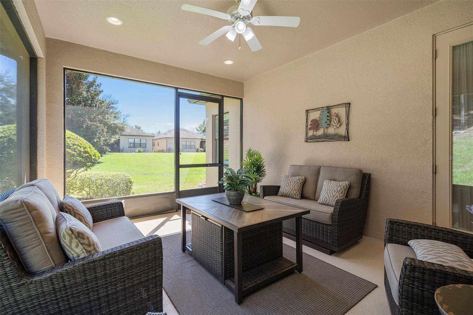 2607 CLEMSON RIDGE COURT, Clermont, FL 34715 Screened Lanai with a view of the backyard