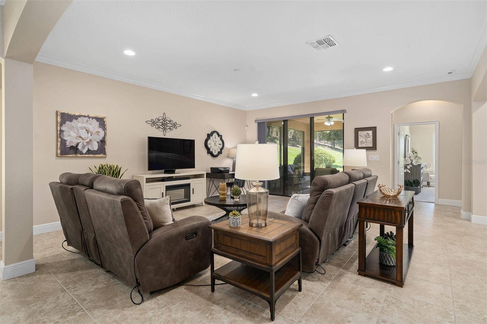 2607 CLEMSON RIDGE COURT, Clermont, FL 34715 Family Room with direct access to the Screened Lanai and a great backyard.