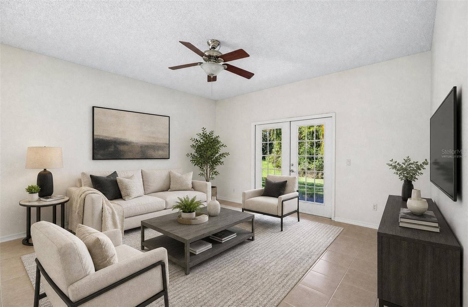 1806 ANNA CATHERINE DRIVE, Orlando, FL 32828 GLASS-PANELED FRENCH DOORS in the Family Room open to the covered back patio, making indoor-outdoor living and entertaining easy. Virtually Staged