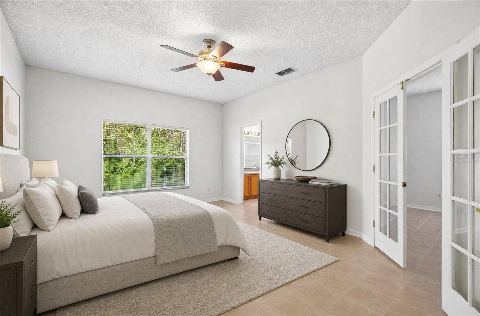 1806 ANNA CATHERINE DRIVE, Orlando, FL 32828 The GENEROUS PRIMARY SUITE provides a relaxing retreat complete with a remarkably SPACIOUS WALK-IN CLOSET and an en suite Bath. Virtually Staged