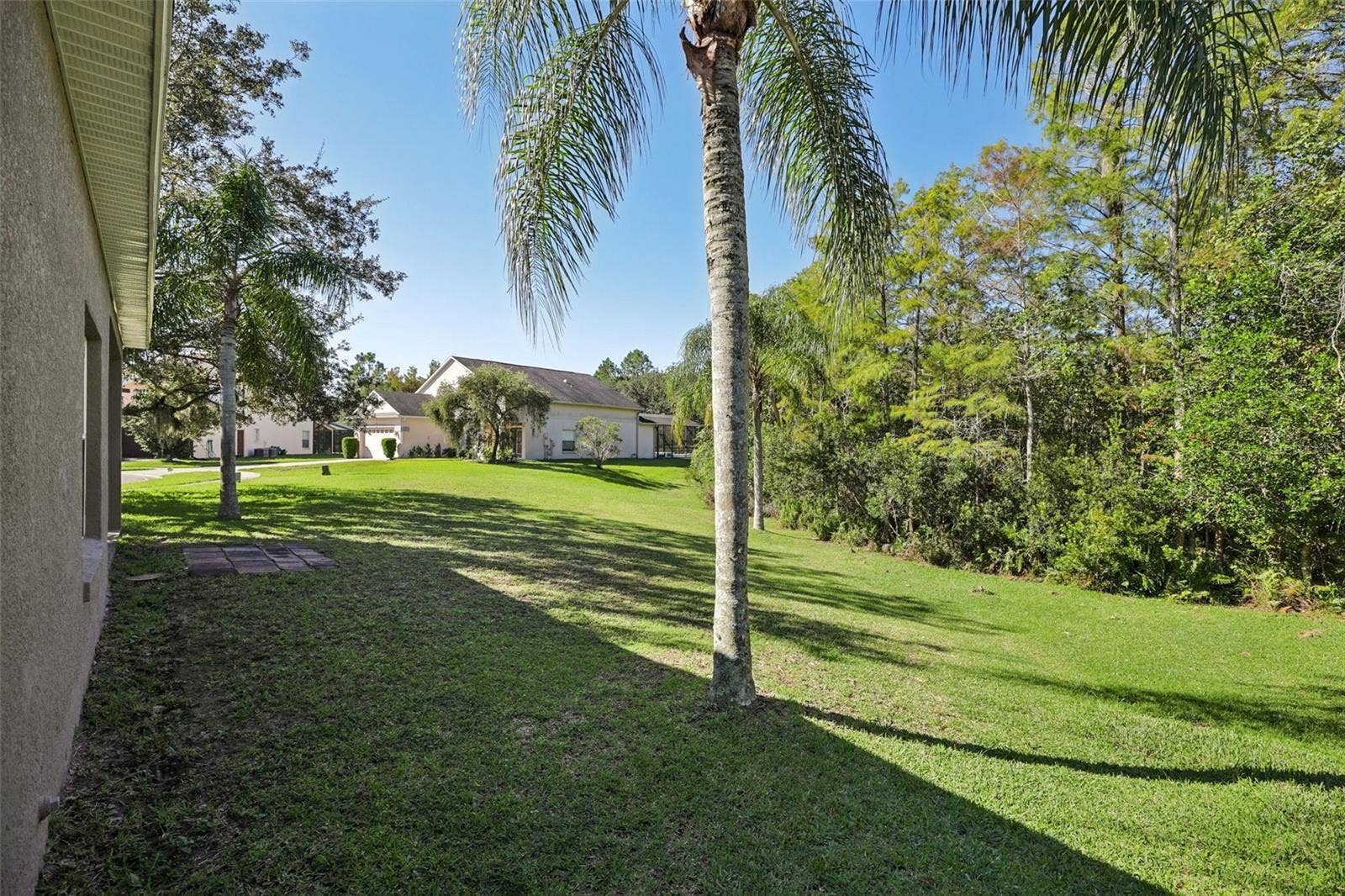 1806 ANNA CATHERINE DRIVE, Orlando, FL 32828 The generous backyard provides endless opportunities for entertaining and enjoying the outdoors.
