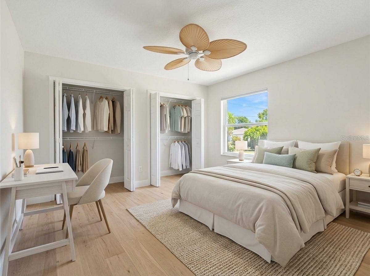 Spacious bedroom featuring dual closets.