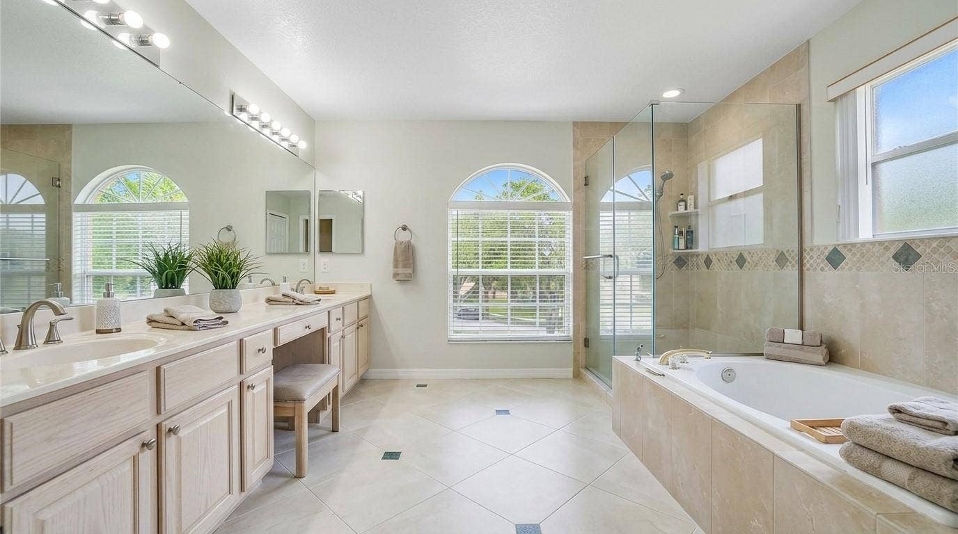 Master bathroom featuring a soaking tub.