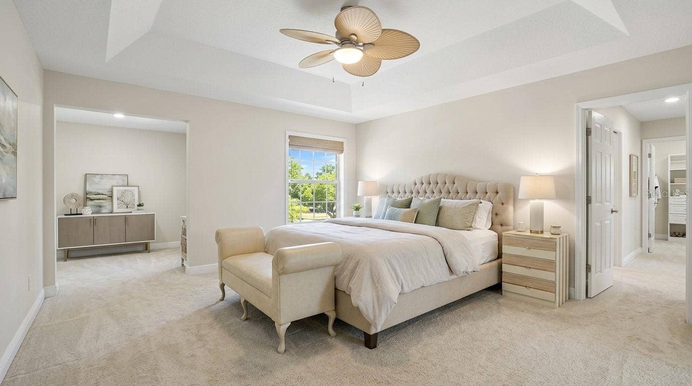 Master bedroom with exterior access and private balcony.
