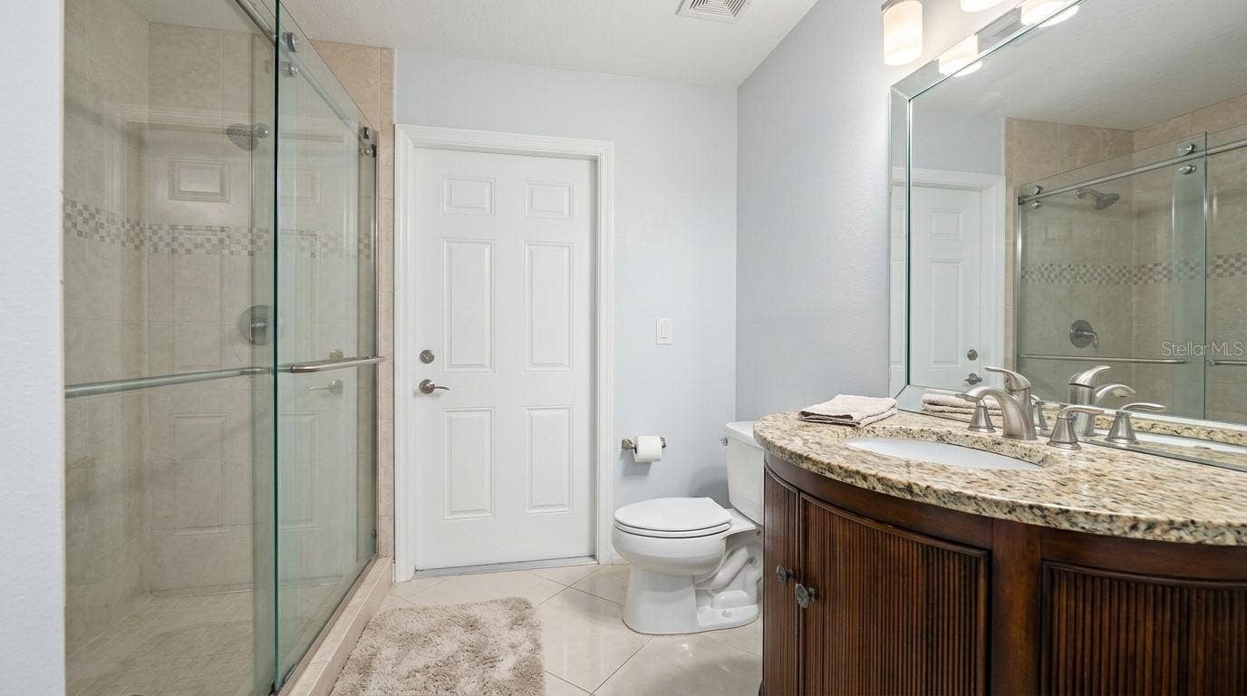 Spacious full bathroom featuring modern fixtures and finishes.