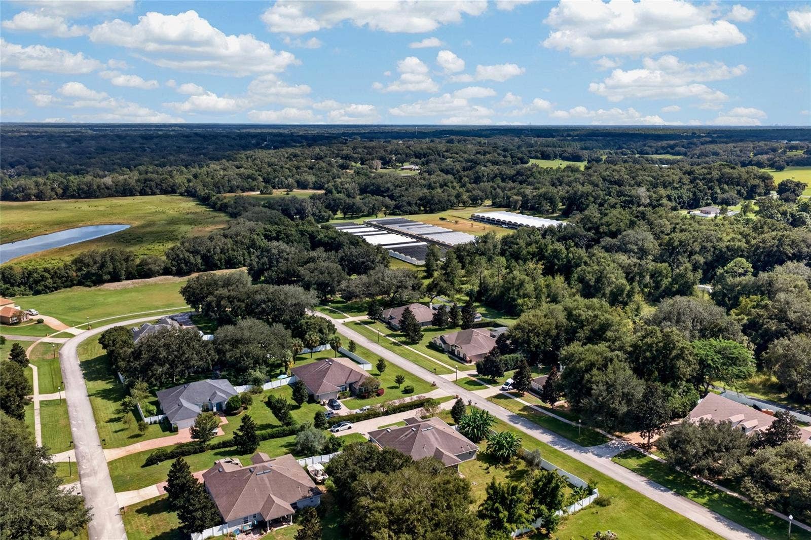 Backing to a hibiscus farm, the property offers a unique backdrop and a sense of privacy