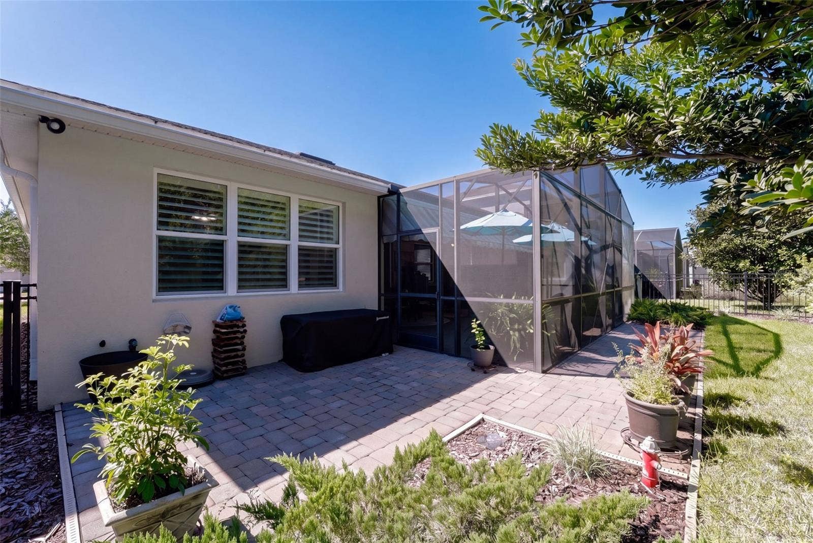 1233 EGGLESTON DRIVE, Deland, FL 32724 Brick paver patio outside of Screen enclosed covered Lanai