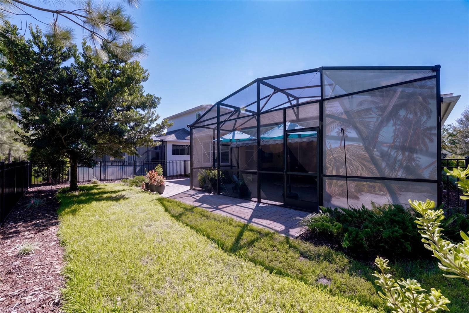 1233 EGGLESTON DRIVE, Deland, FL 32724 View of the aluminum rail fenced backyard