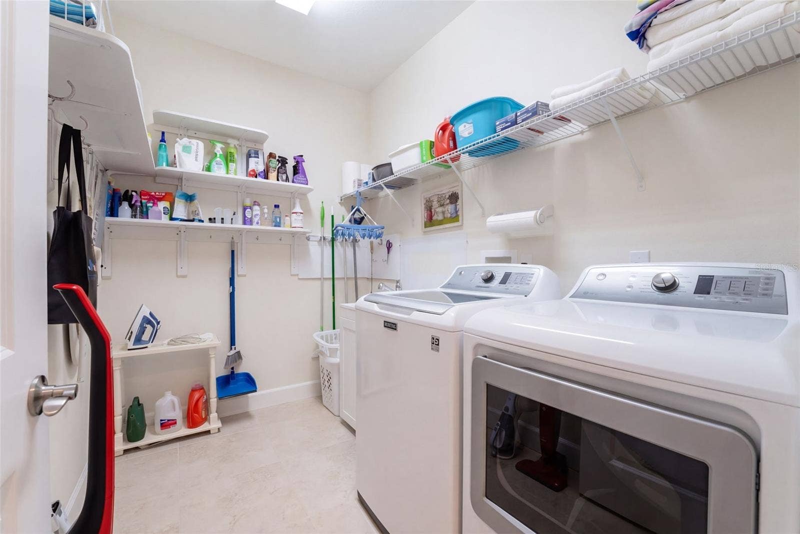 1233 EGGLESTON DRIVE, Deland, FL 32724 9' x 6'6" Utility Room w/ laundry tub, washer, natural gas dryer & storage shelves