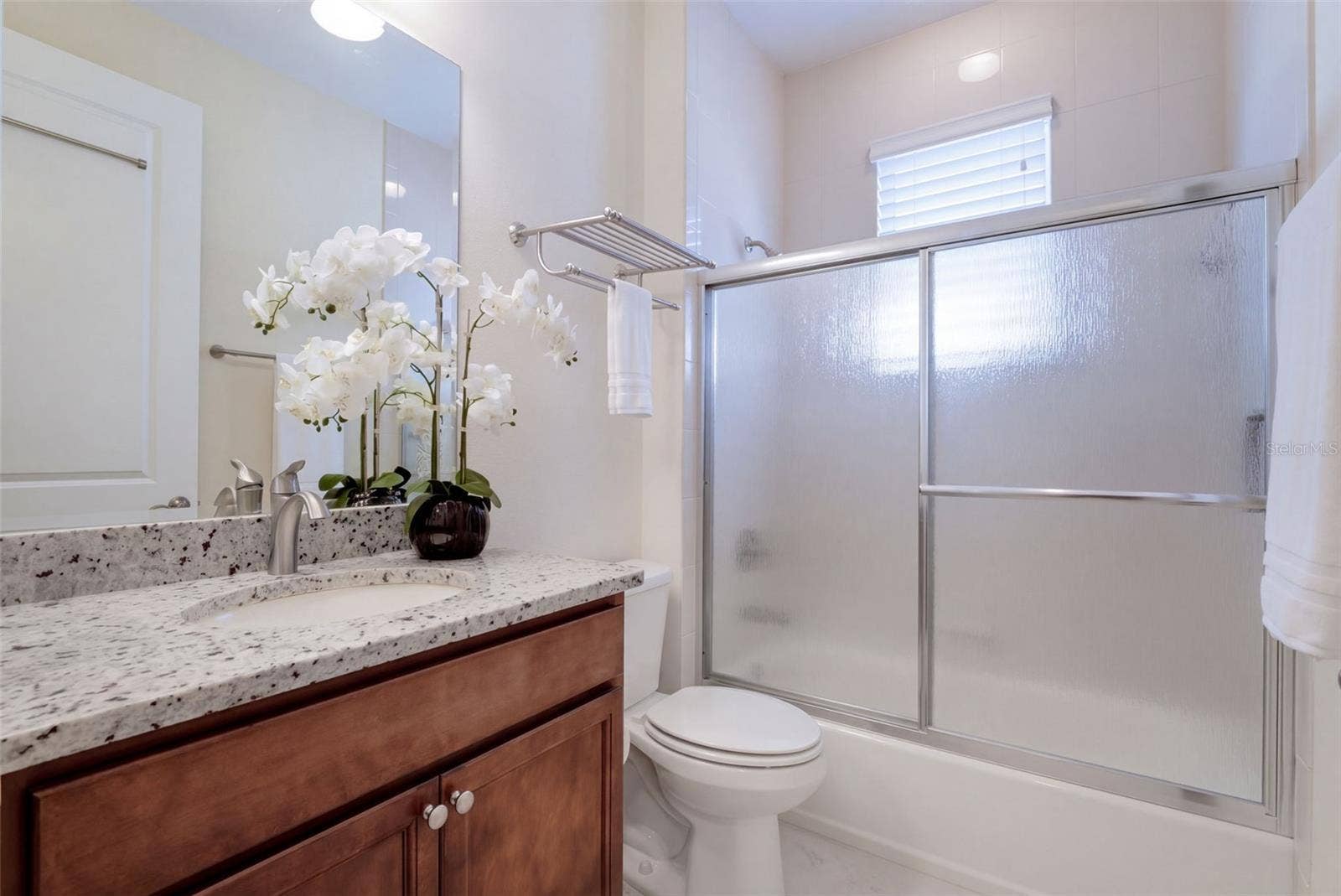 1233 EGGLESTON DRIVE, Deland, FL 32724 Guest Bathroom w/ granite countertop vanity & Tub/Shower combo w/ sliding glass enclosure