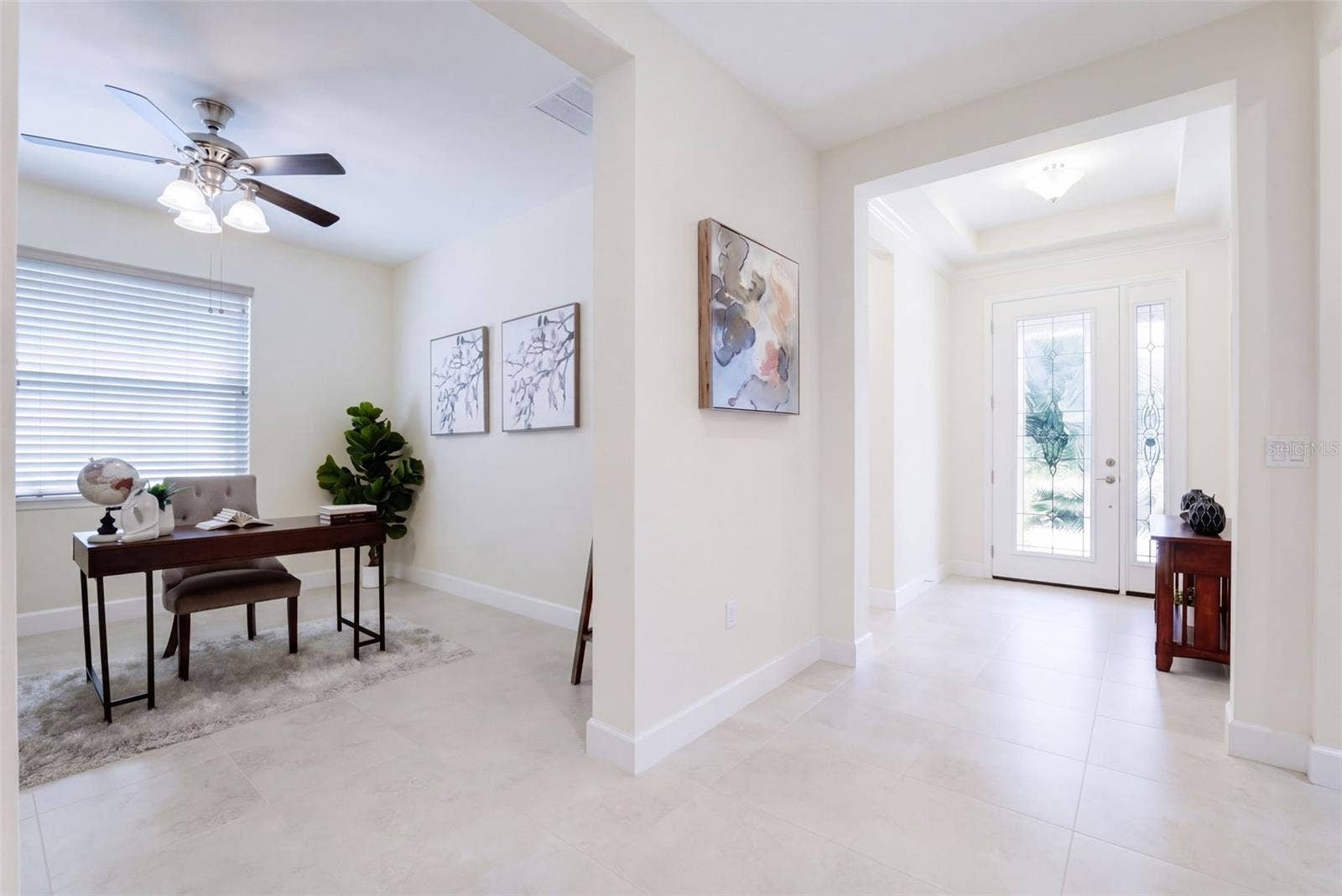 1233 EGGLESTON DRIVE, Deland, FL 32724 Foyer entryway w/ leaded glass door, sliding screen door, porcelain tile & a tray ceiling