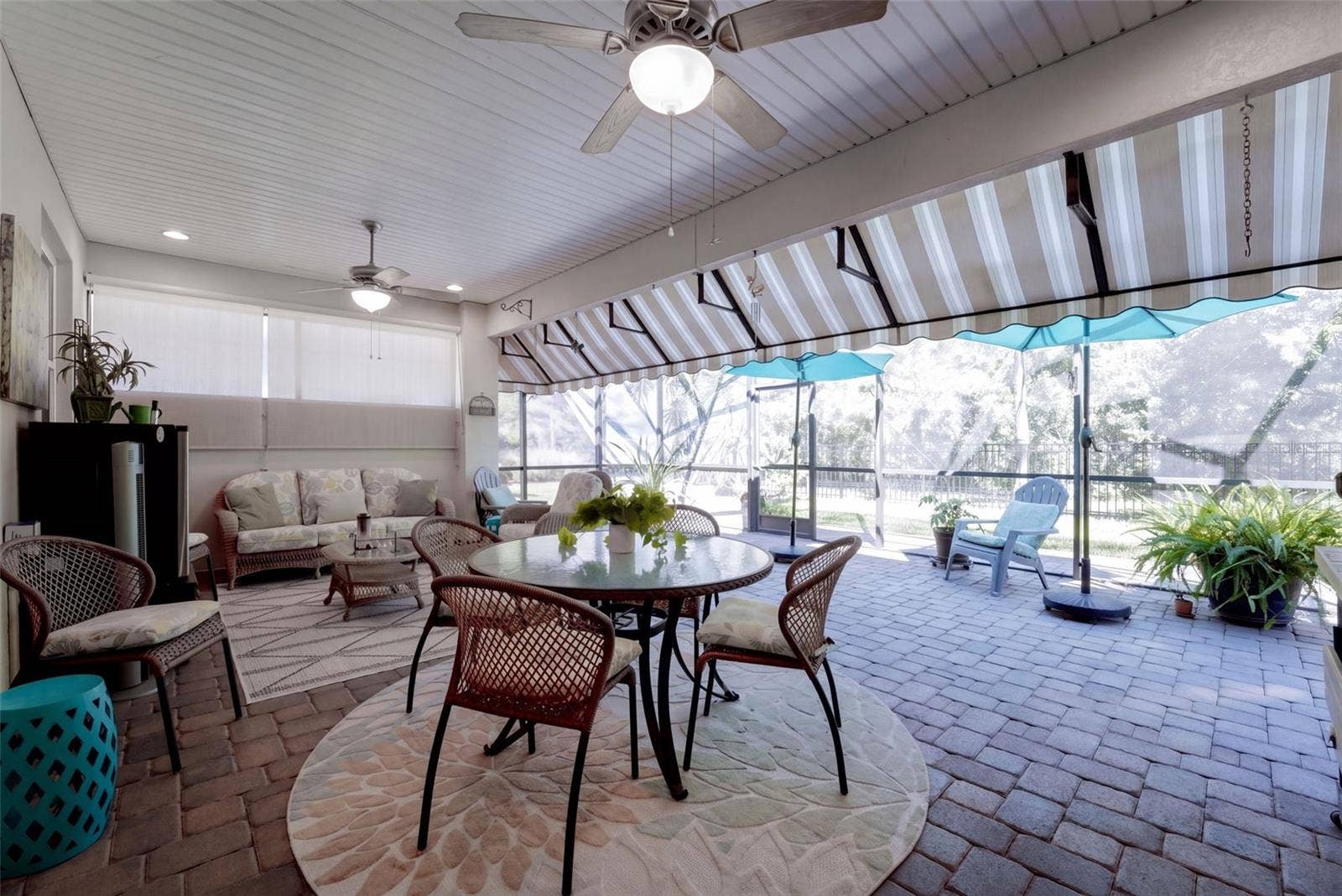 1233 EGGLESTON DRIVE, Deland, FL 32724 24' x 22' Screen enclosed covered Lanai w/ awning, natural gas connection for a grill & ceiling fans