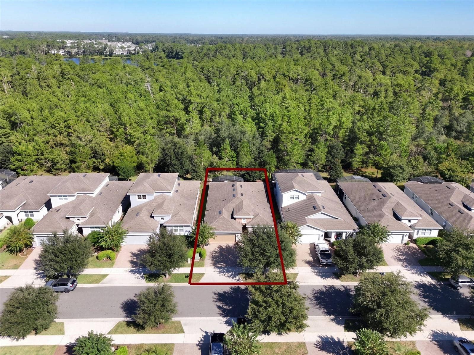 1233 EGGLESTON DRIVE, Deland, FL 32724 Aerial view of Home's location w/ a wooded view