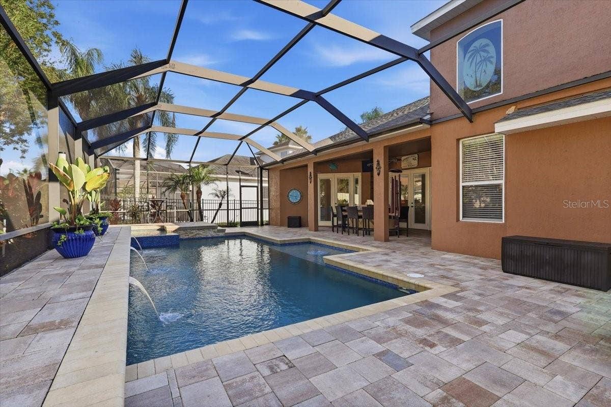 Covered lanai overlooks the private screened pool.