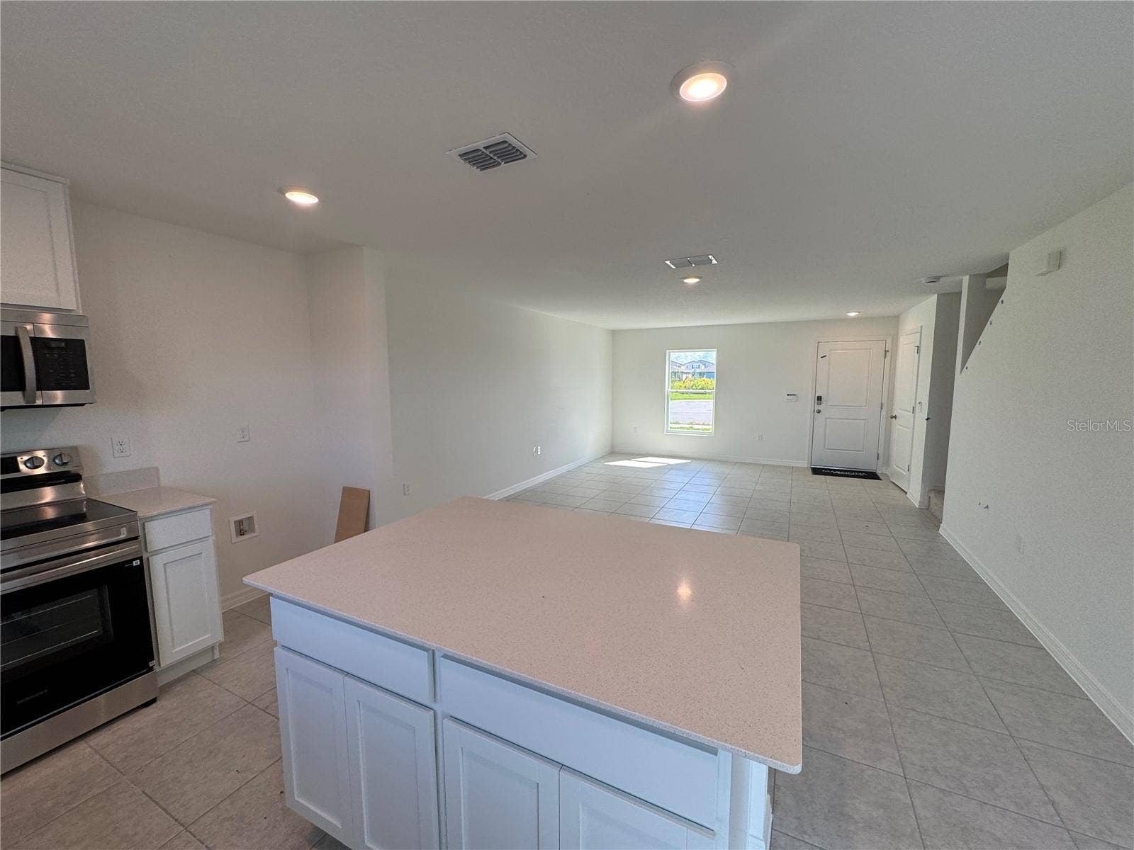 Spacious island & stainless steel appliances