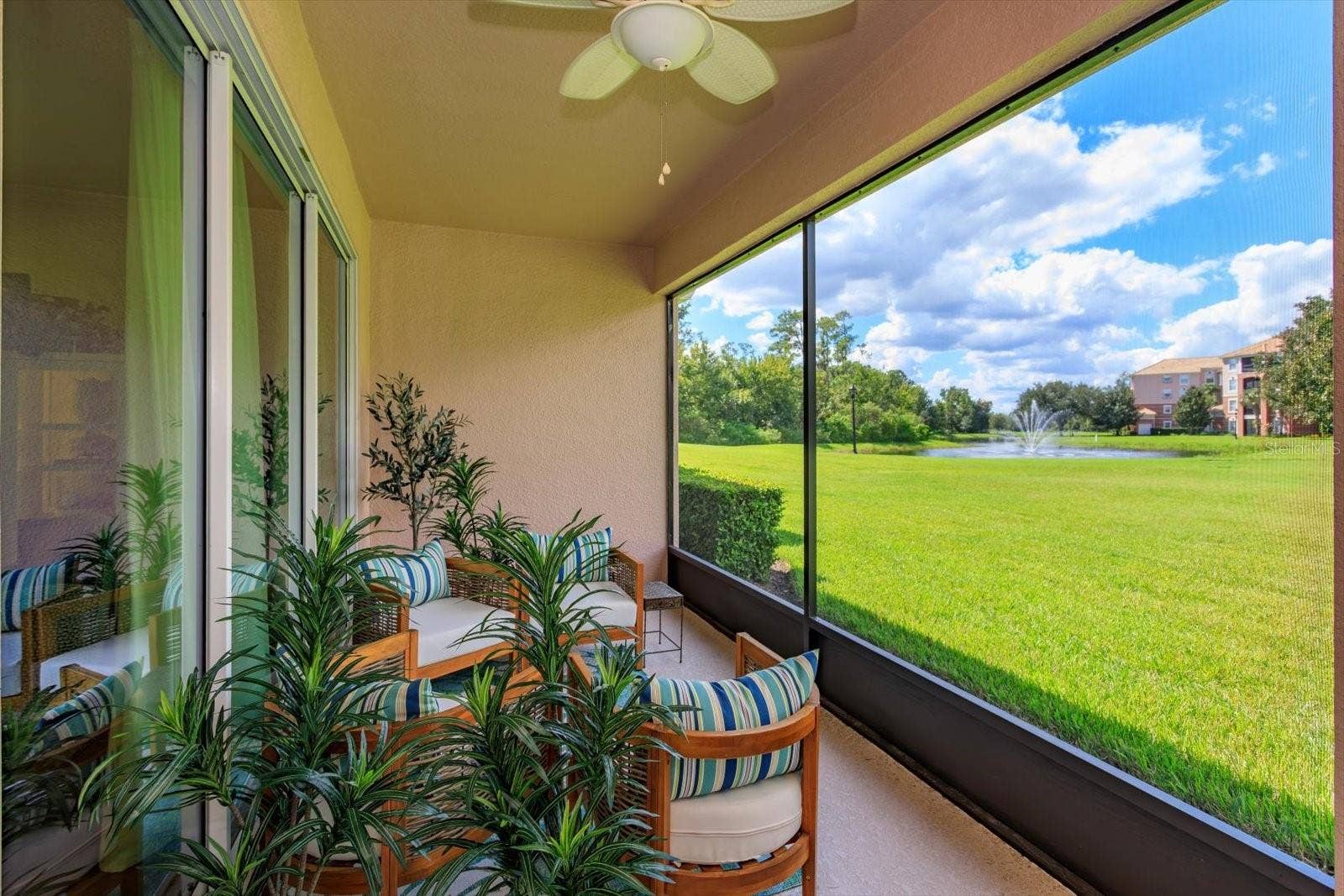 1454 EL CONTE DR, Champions Gate, FL 33896 Back coverd/screened padio