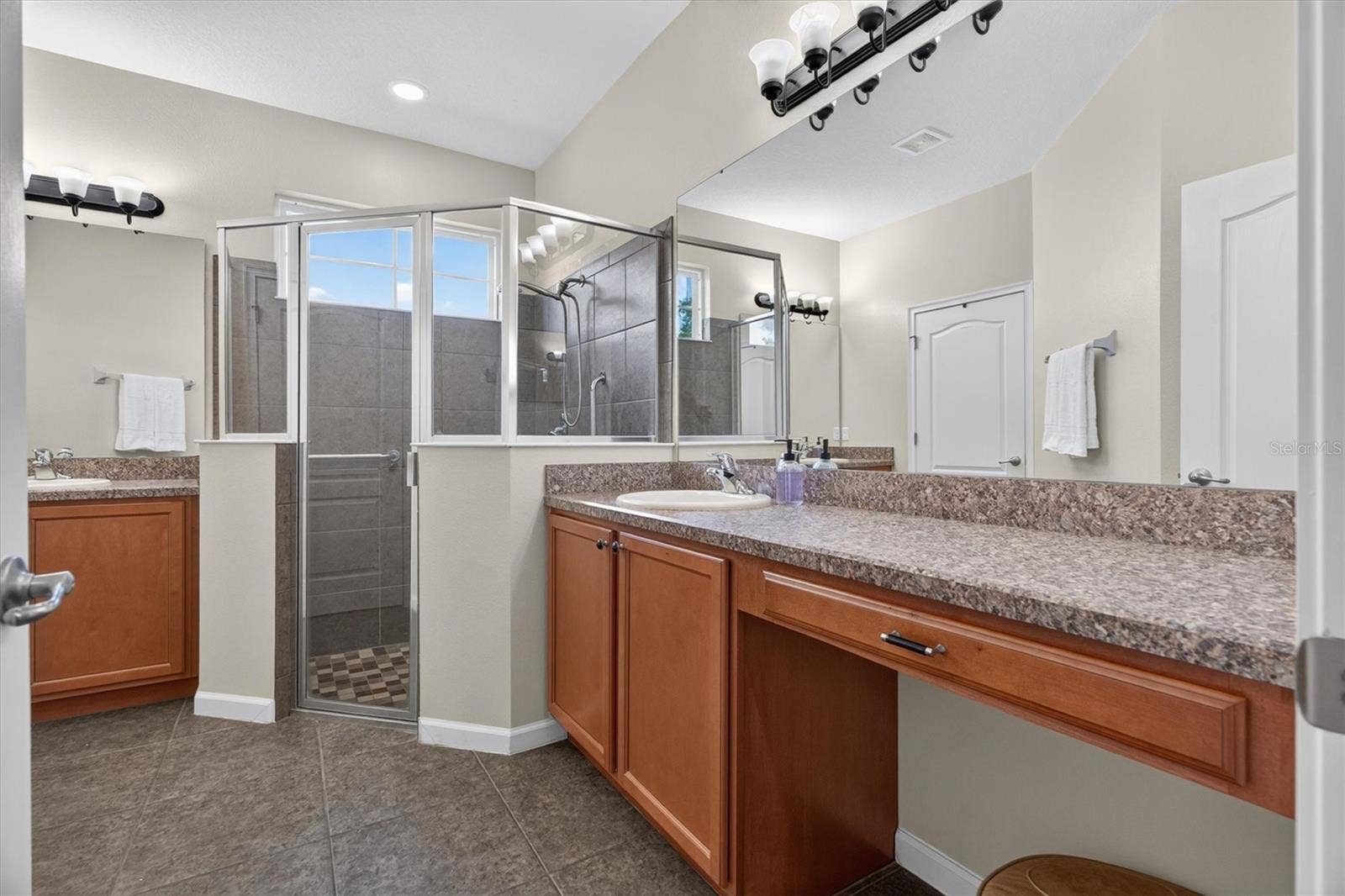 2315 NATOMA BOULEVARD, Mount Dora, FL 32757 Primary bathroom with split vanities
